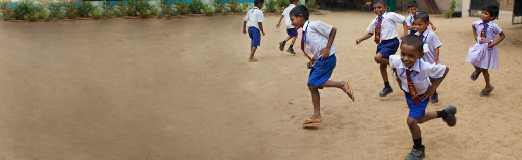 School children running and playing.