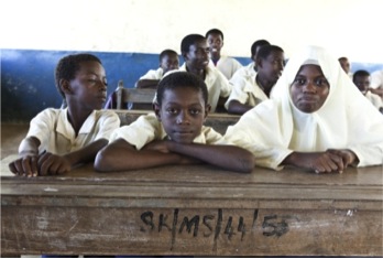 A group of young students in a classroom.