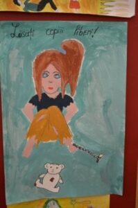 World Day Observance in Bistrita and Lasi, Romania poster of a girl chained to the floor by a child.