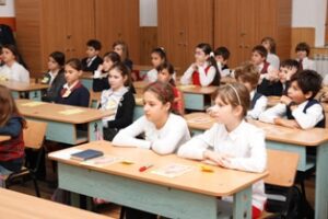 World Day Observance in Bistrita and Lasi, Romania children at their desks in school.