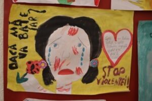 World Day Observance in Bistrita and Lasi, Romania poster of a girl with blood on her face by a child.
