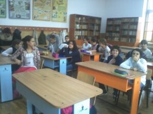 World Day Observance in Bistrita and Lasi, Romania children at their desks in a classroom.