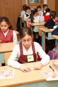 World Day Observance in Bistrita and Lasi, Romania child at desk