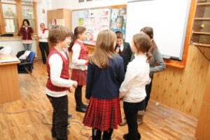 World Day Observance in Bistrita and Lasi, Romania children working together in a classroom.